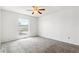 Spacious bedroom with neutral carpet and natural light at 12065 E Kentucky Ave, Aurora, CO 80012