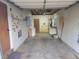 Spacious garage interior with concrete floor, shelving, and overhead storage capabilities at 12065 E Kentucky Ave, Aurora, CO 80012