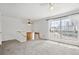 Bright living room with large windows and carpeted floor at 12065 E Kentucky Ave, Aurora, CO 80012