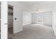 Bedroom with ceiling fan, closet, and large window at 12065 E Kentucky Ave, Aurora, CO 80012