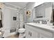 Modern bathroom with tiled shower, vanity, and stylish decor offers a clean and functional space at 12420 E Iliff Pl, Aurora, CO 80014