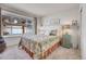 Serene bedroom with a plush bed, large window, and soft carpeting, creating a relaxing retreat at 12420 E Iliff Pl, Aurora, CO 80014