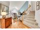 Inviting living room with vaulted ceilings, hardwood floors, large windows, and elegant decor at 12420 E Iliff Pl, Aurora, CO 80014