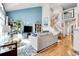 Spacious living area with modern furnishings, a high ceiling, natural light, and open staircase at 12420 E Iliff Pl, Aurora, CO 80014