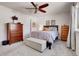 Inviting main bedroom with a ceiling fan, ample natural light, and tasteful decor at 12420 E Iliff Pl, Aurora, CO 80014