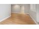 Open basement space featuring hardwood floors and ample natural light from window at 2749 Pemberly Ave, Highlands Ranch, CO 80126