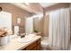 This bathroom features a single sink with wood cabinets and a shower with a tub at 2749 Pemberly Ave, Highlands Ranch, CO 80126