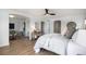 This bedroom boasts hardwood floors, neutral paint, and a decorative ceiling fan at 2749 Pemberly Ave, Highlands Ranch, CO 80126