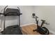 At-home gym featuring a treadmill, exercise bike and bright flooring at 2749 Pemberly Ave, Highlands Ranch, CO 80126