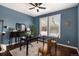 Stylish home office with wood floors, a ceiling fan, and natural light from the window creates a productive workspace at 2749 Pemberly Ave, Highlands Ranch, CO 80126