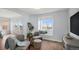 The living room is bright with lots of natural light, hardwood floors, and neutral colors at 2749 Pemberly Ave, Highlands Ranch, CO 80126