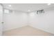 Carpeted basement offers natural light with multiple windows and a clean, open space at 2989 S Corona St, Englewood, CO 80113