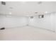 Unfinished basement space with carpet, recessed lighting, and multiple windows for natural light at 2989 S Corona St, Englewood, CO 80113