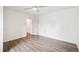 Spacious bedroom features wood flooring, natural light and open access to the ensuite bathroom at 2989 S Corona St, Englewood, CO 80113