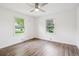 A simple yet bright bedroom featuring hardwood floors, recessed lighting, and natural light at 2989 S Corona St, Englewood, CO 80113