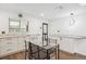 Bright eat-in kitchen featuring white cabinets, granite countertops and new appliances at 2989 S Corona St, Englewood, CO 80113