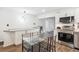 Modern kitchen with stainless steel oven and cooktop, granite countertops, and an open view at 2989 S Corona St, Englewood, CO 80113