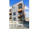 A modern townhome with a mixed material facade, multiple balconies, and contemporary design at 3017 W 53Rd Ave, Denver, CO 80221
