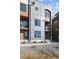 Modern multi-story home showcasing a sleek facade, balconies, and contemporary design elements at 3017 W 53Rd Ave, Denver, CO 80221