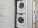 Conveniently stacked washer and dryer in a bright laundry area at 3017 W 53Rd Ave, Denver, CO 80221