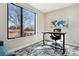Bright office with large window offering natural light and outdoor views, complemented by a modern desk and chair at 3017 W 53Rd Ave, Denver, CO 80221
