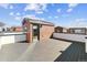 Private rooftop deck with multiple buildings and a large deck floor at 3017 W 53Rd Ave, Denver, CO 80221