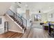 Modern staircase with black railings leading to the upper level of the home at 3017 W 53Rd Ave, Denver, CO 80221