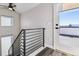 View of a stairwell and entry to a deck with mountain views beyond at 3017 W 53Rd Ave, Denver, CO 80221