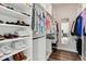 Well-organized walk-in closet with shelving for shoes and hanging space for clothes at 3017 W 53Rd Ave, Denver, CO 80221