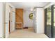 Unique bedroom boasts a round window and sliding glass door to the outside, plus built-in storage and closet at 4923 Snowberry Ln, Evergreen, CO 80439