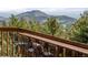 Enjoy mountain views from this deck with seating at 4923 Snowberry Ln, Evergreen, CO 80439
