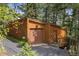 Wood exterior with a garage at 4923 Snowberry Ln, Evergreen, CO 80439