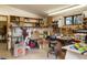 Workbench inside the garage with storage shelves at 4923 Snowberry Ln, Evergreen, CO 80439