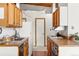 Functional kitchen with ample counter space, wooden cabinets, and modern appliances at 4923 Snowberry Ln, Evergreen, CO 80439
