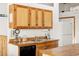 Well-lit kitchen features wood counters and cabinetry, perfect for cooking and entertaining at 4923 Snowberry Ln, Evergreen, CO 80439