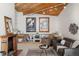 Inviting living room features a fireplace, eclectic decor, wooden ceilings and plush seating at 4923 Snowberry Ln, Evergreen, CO 80439
