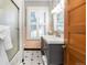 Updated bathroom with a shower, a modern vanity, and a pink tiled wall at 2519 N Gilpin St, Denver, CO 80205