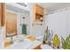 Bathroom with patterned shower curtain, and wooden cabinets at 343 W Lehow Ave # 22, Englewood, CO 80110