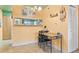 Bright dining area with a table set for four, showcasing an open design and warm yellow walls at 343 W Lehow Ave # 22, Englewood, CO 80110