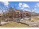 A full view of the exterior of this townhouse showcasing its multi-story architecture and surrounding landscape at 343 W Lehow Ave # 22, Englewood, CO 80110