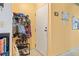 A bright and functional foyer or entry area, showing storage for coats and shoes, and a door to the main living space at 343 W Lehow Ave # 22, Englewood, CO 80110