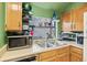 Compact kitchen area showcasing stainless steel appliances and ample counter space for meal preparation at 343 W Lehow Ave # 22, Englewood, CO 80110