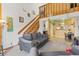 A living room featuring stairs leading up to the next level and an open view to the kitchen with comfortable seating at 343 W Lehow Ave # 22, Englewood, CO 80110