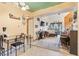 View of an open-concept layout with living room and dining area with a large window and comfortable seating at 343 W Lehow Ave # 22, Englewood, CO 80110