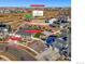 Wonderful aerial view of home, detailing its location on a half acre lot next to Green Valley Ranch Golf Club, and a 3-car tandem garage at 20783 E 50Th Pl, Denver, CO 80249