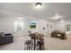 Finished basement with TV, seating, bar and ping pong table at 20783 E 50Th Pl, Denver, CO 80249