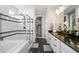 Bright bathroom with glass enclosed shower, soaker tub and walk in closet at 20783 E 50Th Pl, Denver, CO 80249