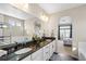 Bathroom with granite countertop, double sink and large tub at 20783 E 50Th Pl, Denver, CO 80249