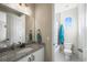 Clean bathroom with granite countertop and bathtub at 20783 E 50Th Pl, Denver, CO 80249