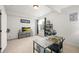 Modern bedroom with neutral colors, stylish desk, window, and media center at 20783 E 50Th Pl, Denver, CO 80249
